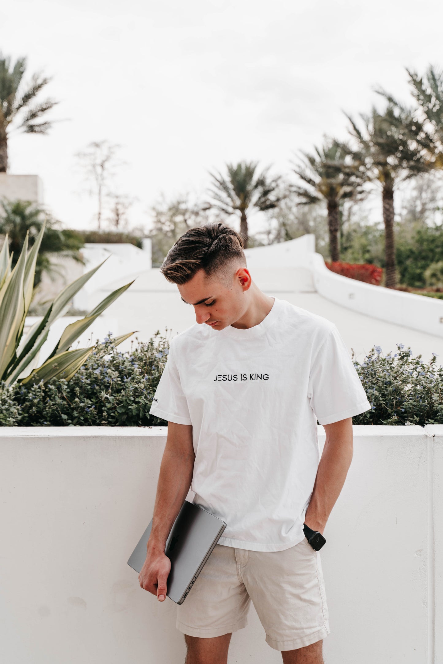 Man wearing “Jesus Is King” short sleeve shirt – Christian minimalist tee