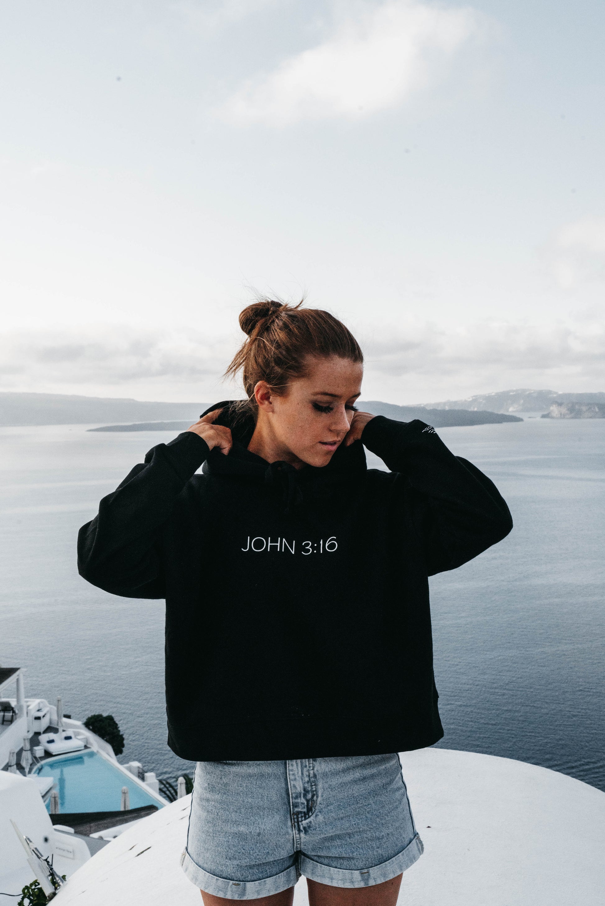Woman in “John 3:16” hoodie – gospel-centered minimalist hoodie