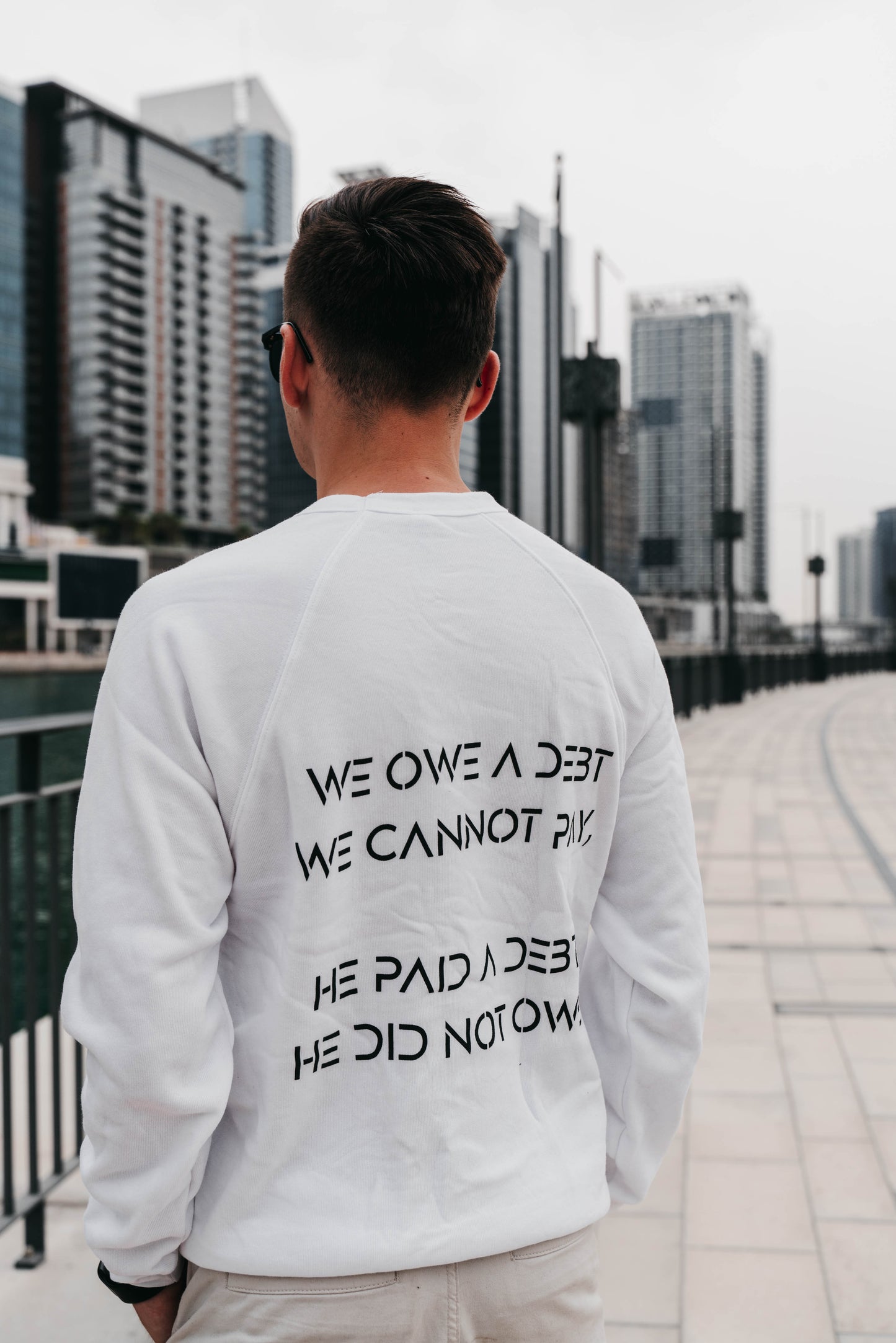 " WE OWE A DEBT.. " Men's White Crewneck
