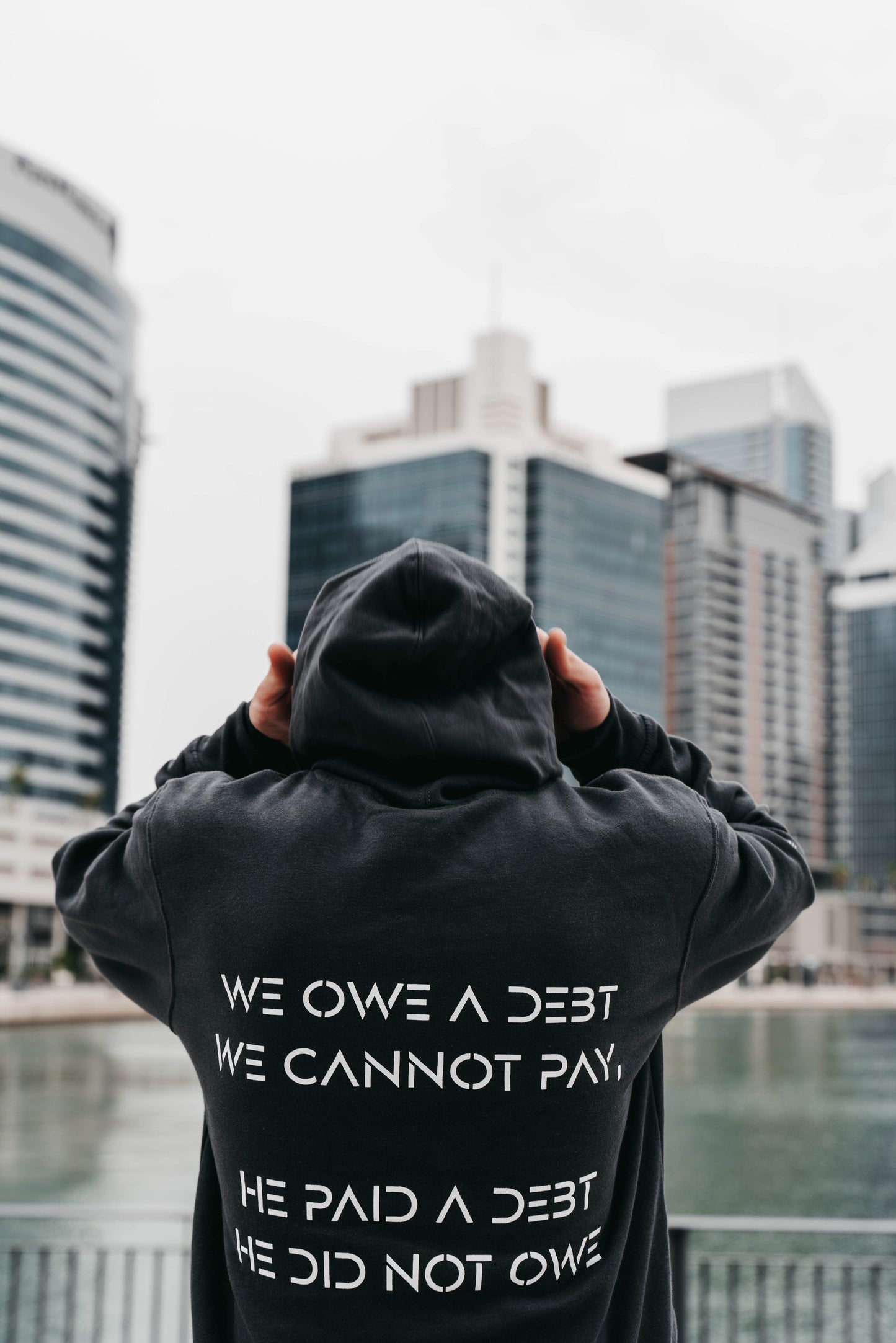 " WE OWE A DEBT.. " Unisex Charcoal Grey Hoodie