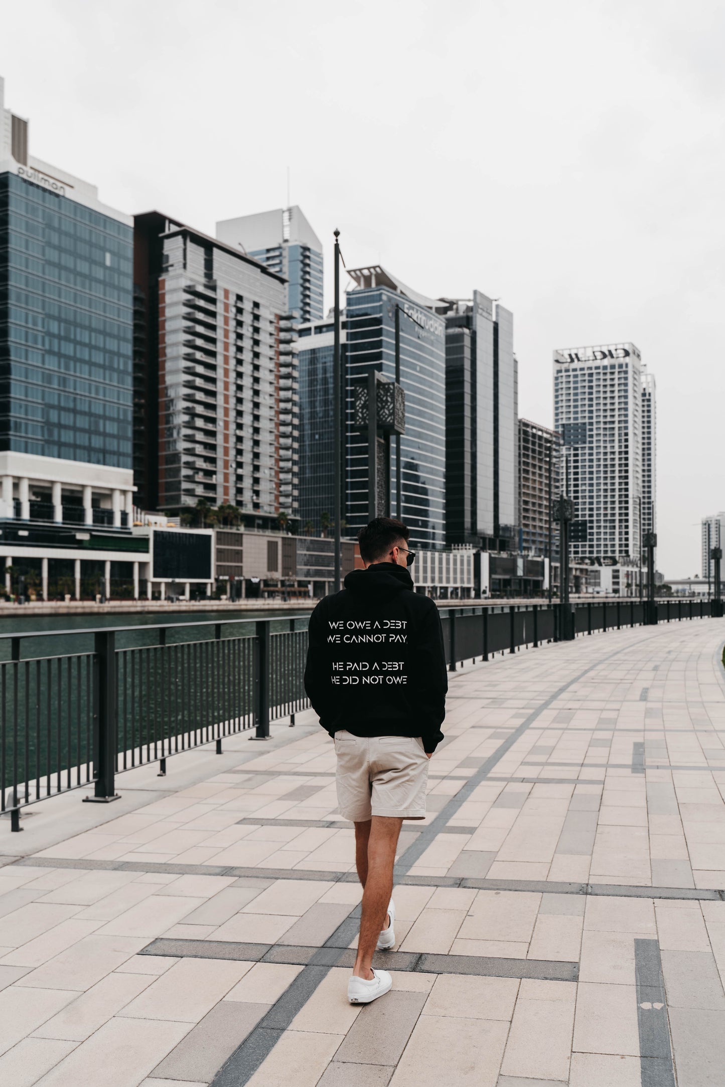 " WE OWE A DEBT.. " Unisex Black Hoodie